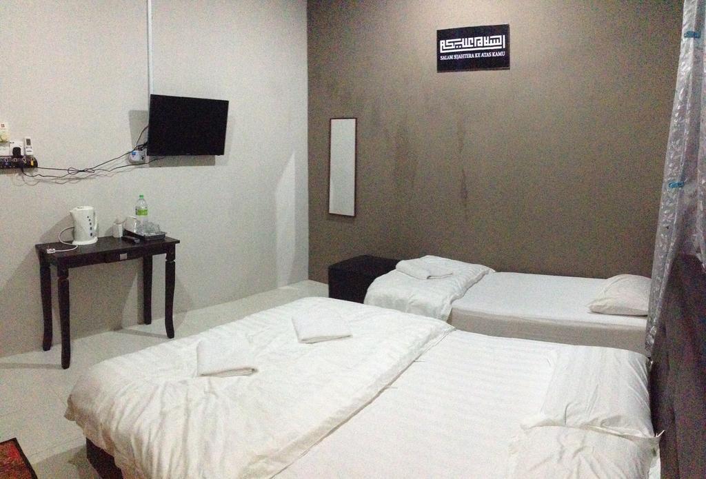 Anggun Beach Guest House Paka Номер фото