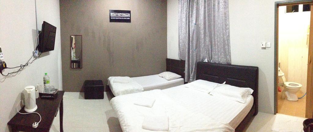 Anggun Beach Guest House Paka Номер фото