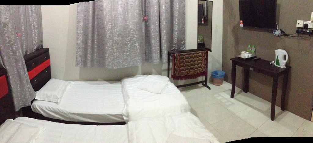 Anggun Beach Guest House Paka Номер фото
