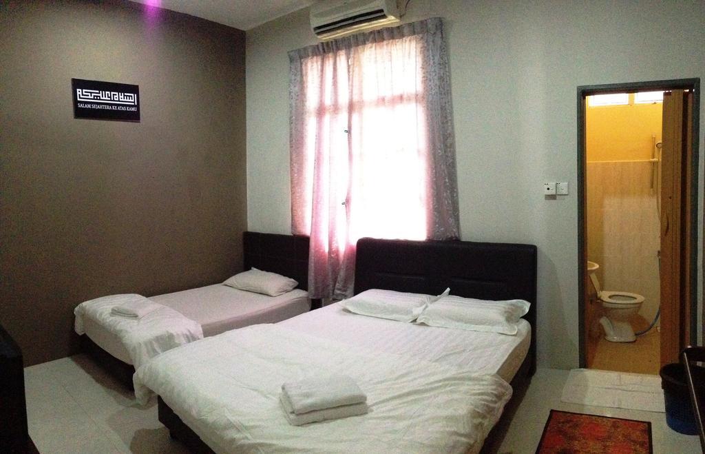Anggun Beach Guest House Paka Номер фото